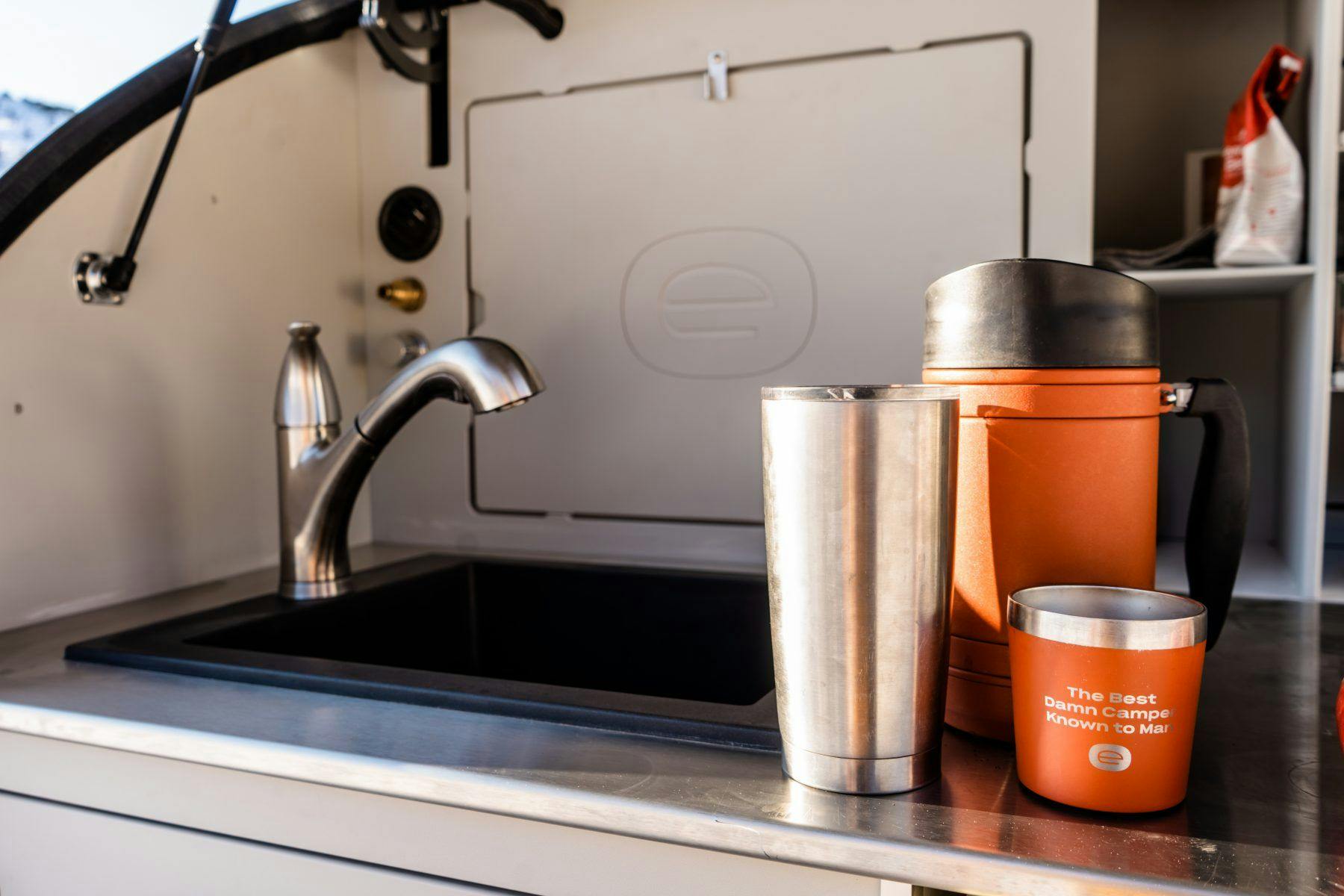 The galley of a teardrop trailer, with coffee ready to go.