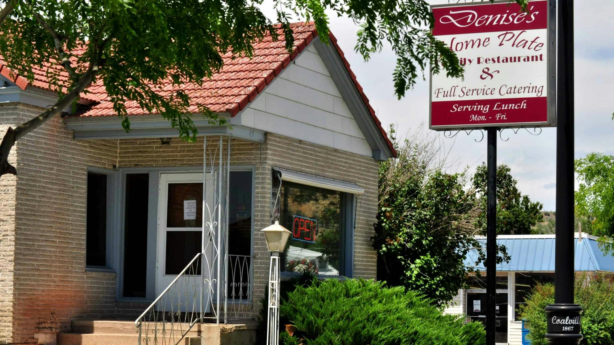 The exterior of a small town diner.