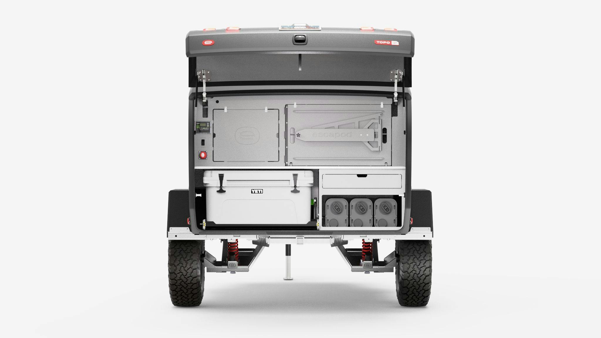 A rendering of the TOPO2 Nomad, featuring the camp kitchen with jerry cans, YETI cooler, cutting board, and table.