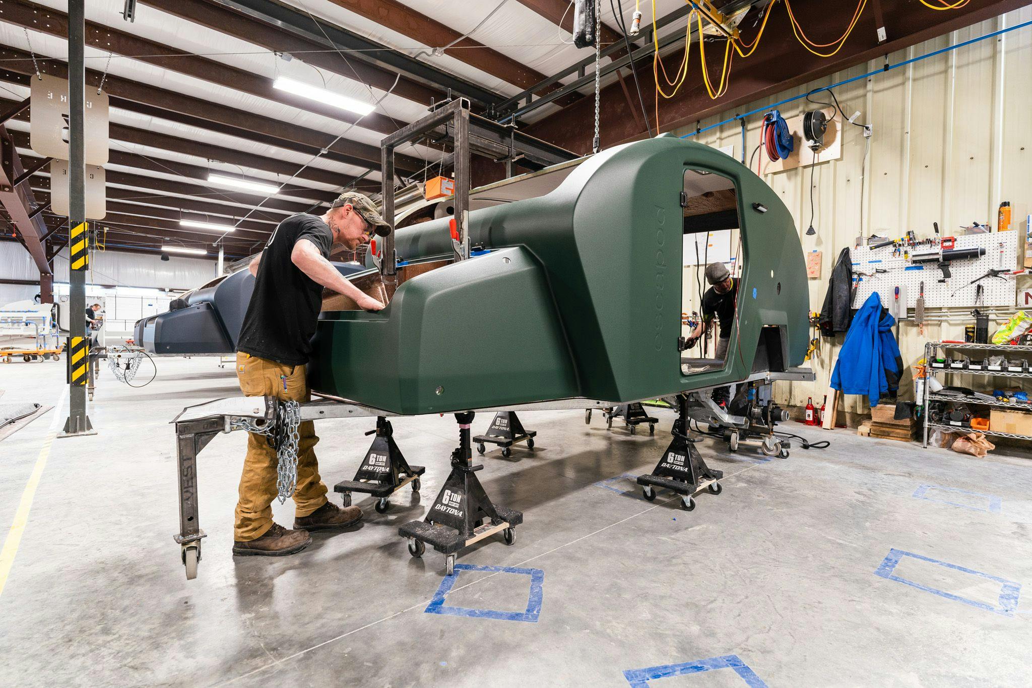 A team member working on the construction of a TOPO2, an offroad trailer.