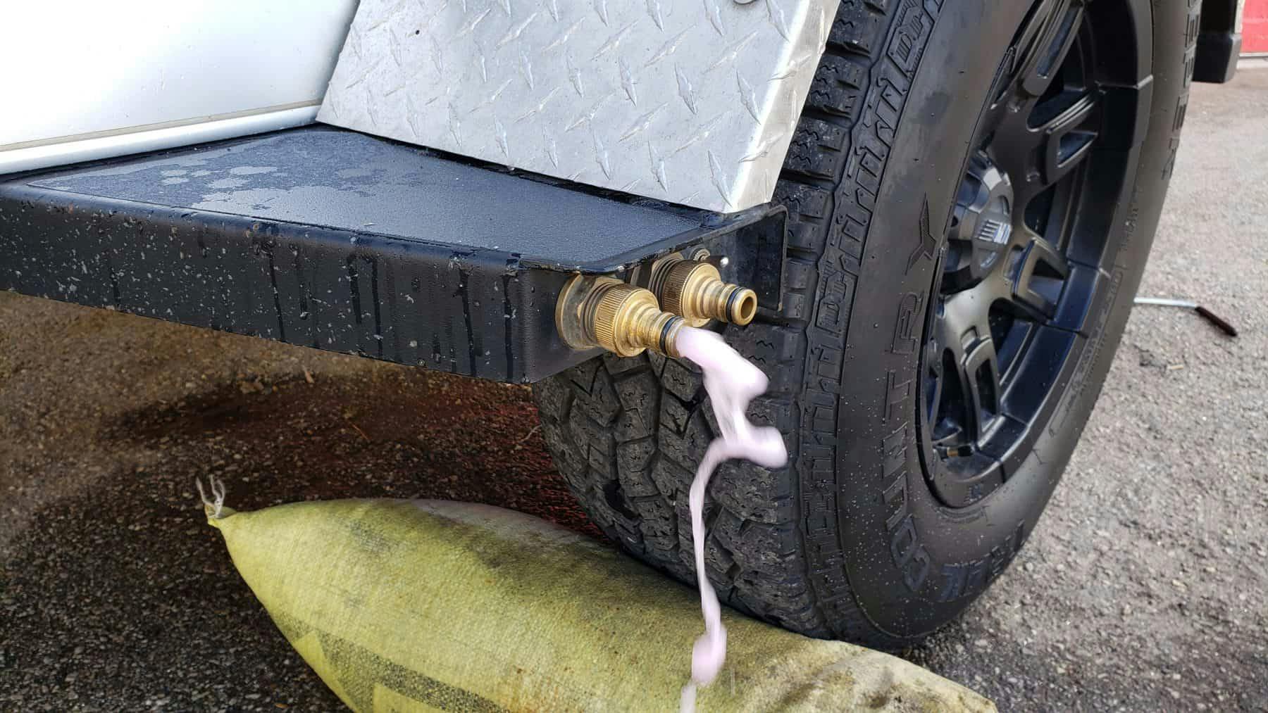 Antifreeze coming out of the water output of an Original TOPO, an adventure trailer.