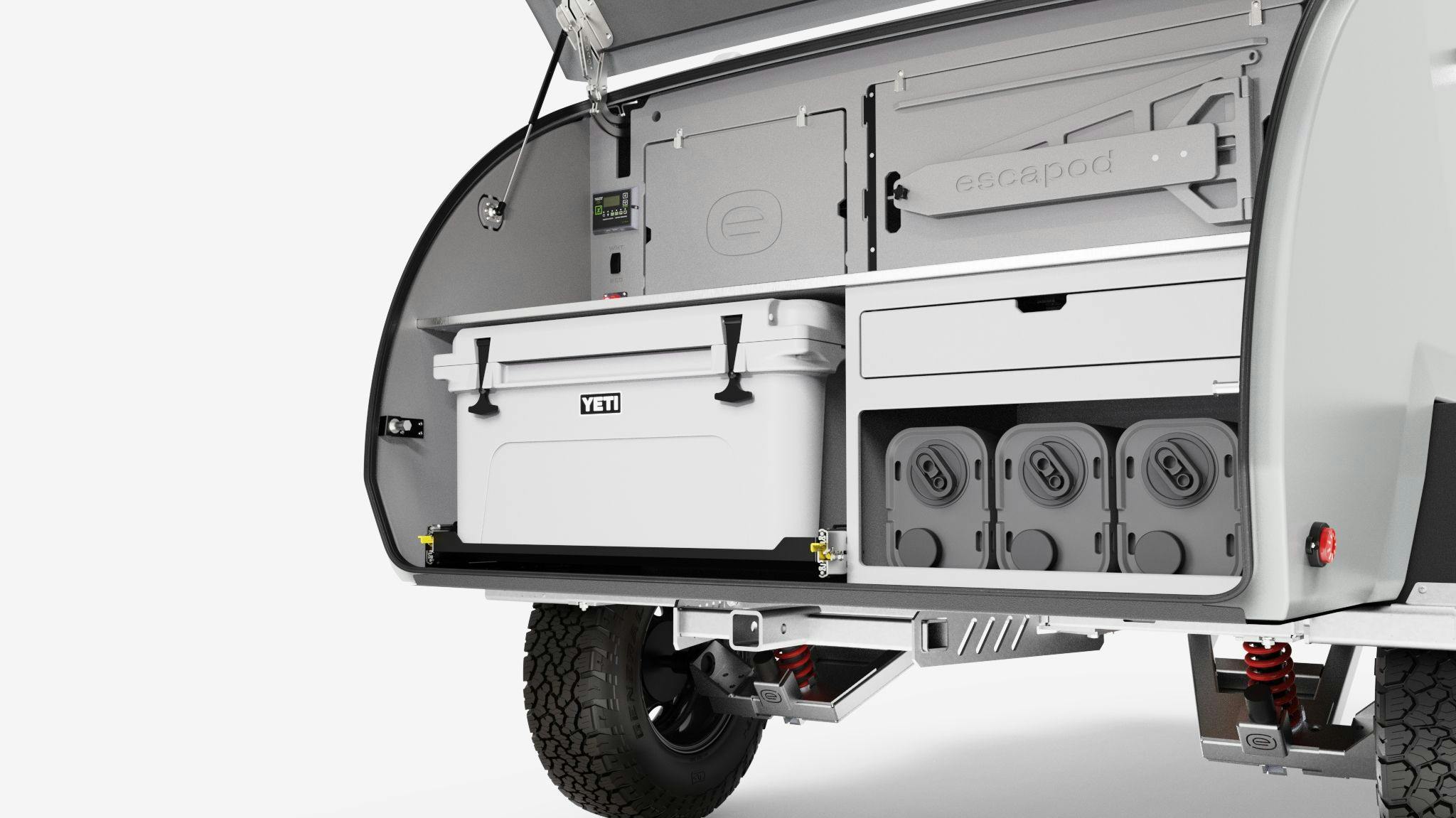 A rendering of the TOPO2 Nomad, featuring the camp kitchen with jerry cans, YETI cooler, cutting board, and table.